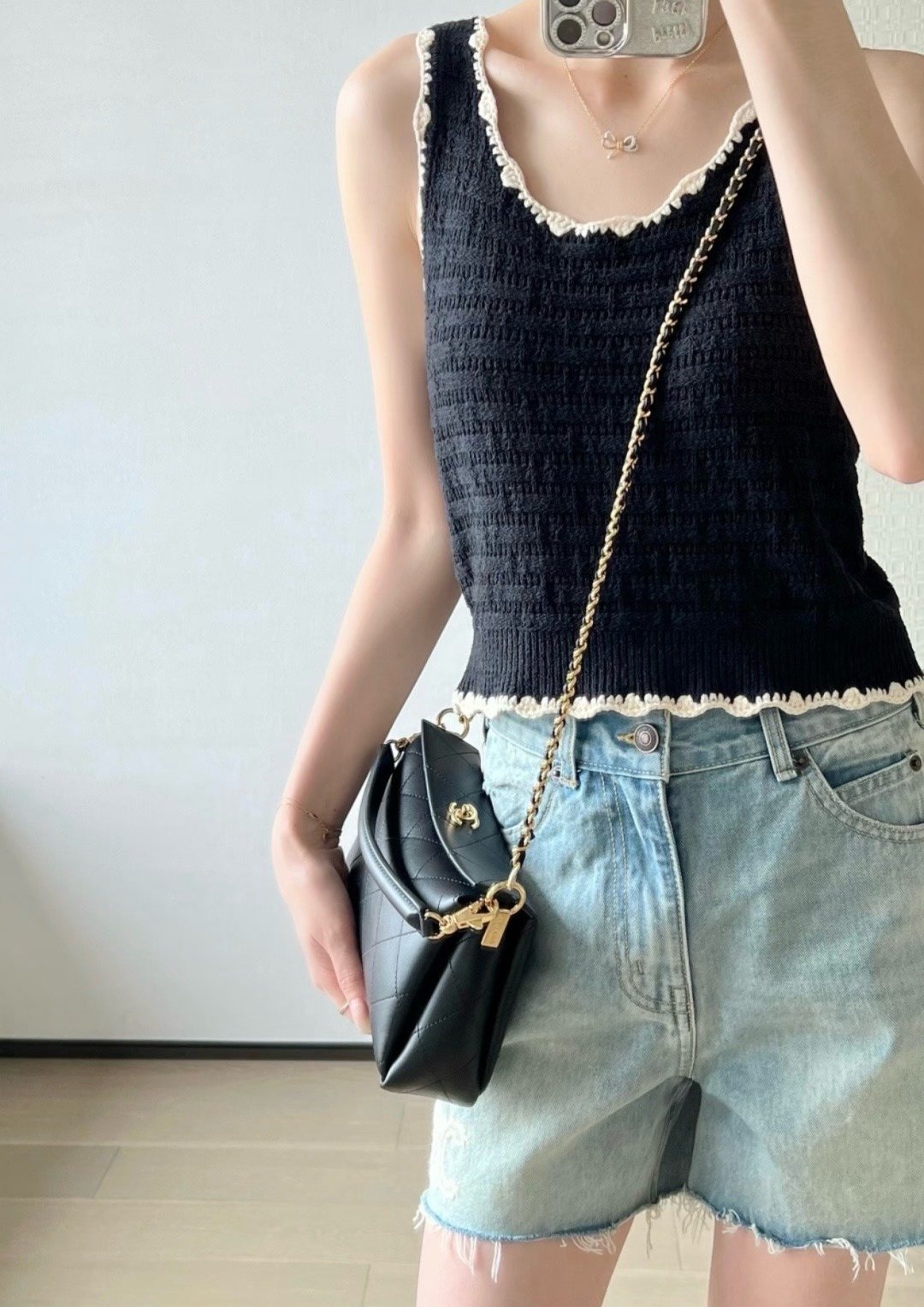 Chanel Black Diamond-Quilted Top Handle Bag — model