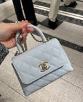 Chanel Diamond-Quilted Top-Handle Flap Bag — hero