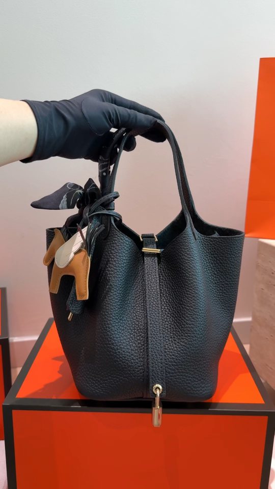 Hermès Pebbled Bucket Bag with Padlock — hero