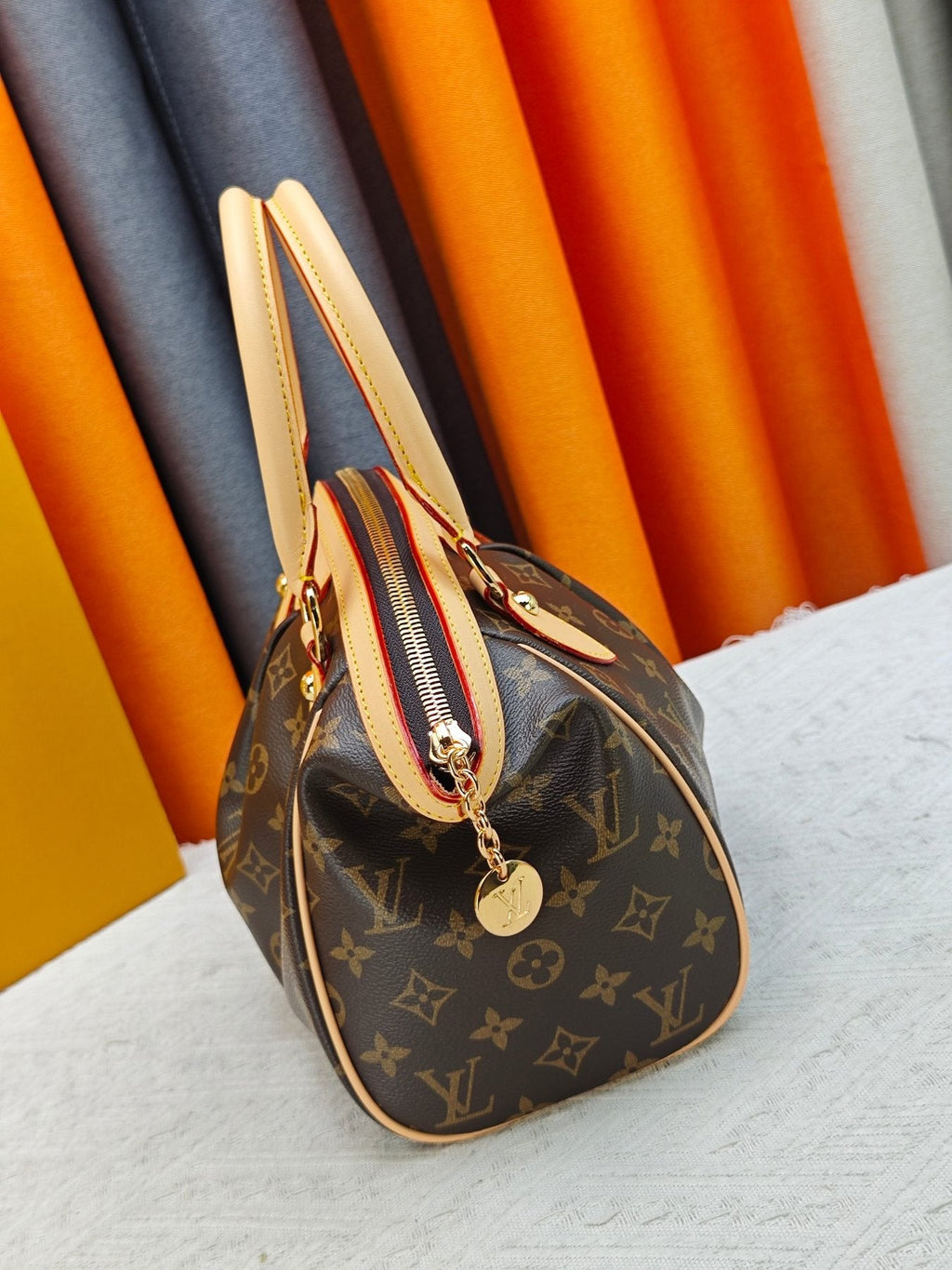 Louis Vuitton Tivoli Monogram Bowling Handbag — side