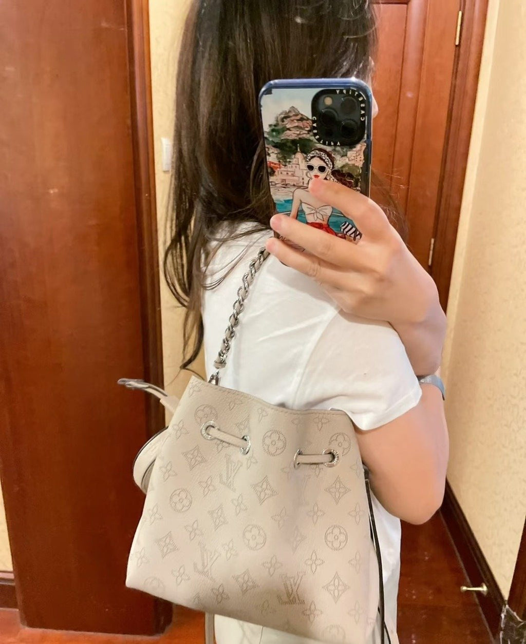Louis Vuitton Bella Perforated Monogram Bucket Bag — model