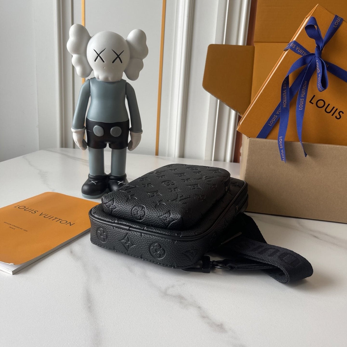 Louis Vuitton Avenue Sling Bag PM in Black Embossed Leather — detail
