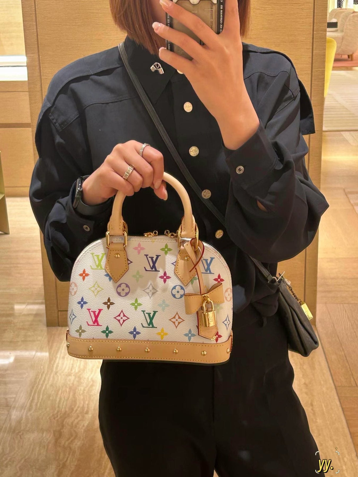 Louis Vuitton Alma BB Monogram Top-Handle Bag — model