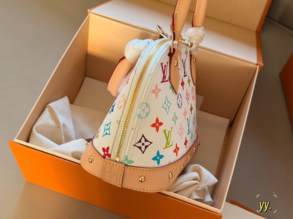 Louis Vuitton Alma BB Monogram Top-Handle Bag — side