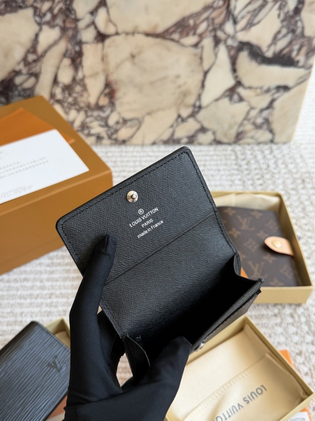 Louis Vuitton Textured Black Folding Card Holder — front