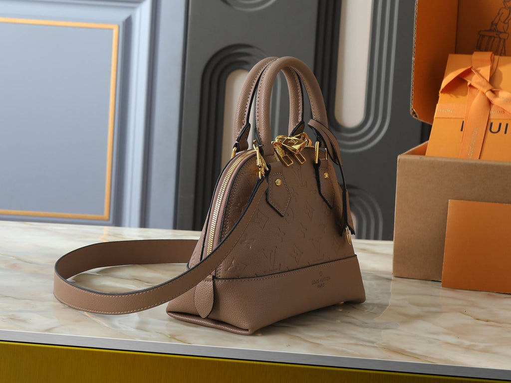 Louis Vuitton Neo Alma Empreinte Top-Handle Bag — side