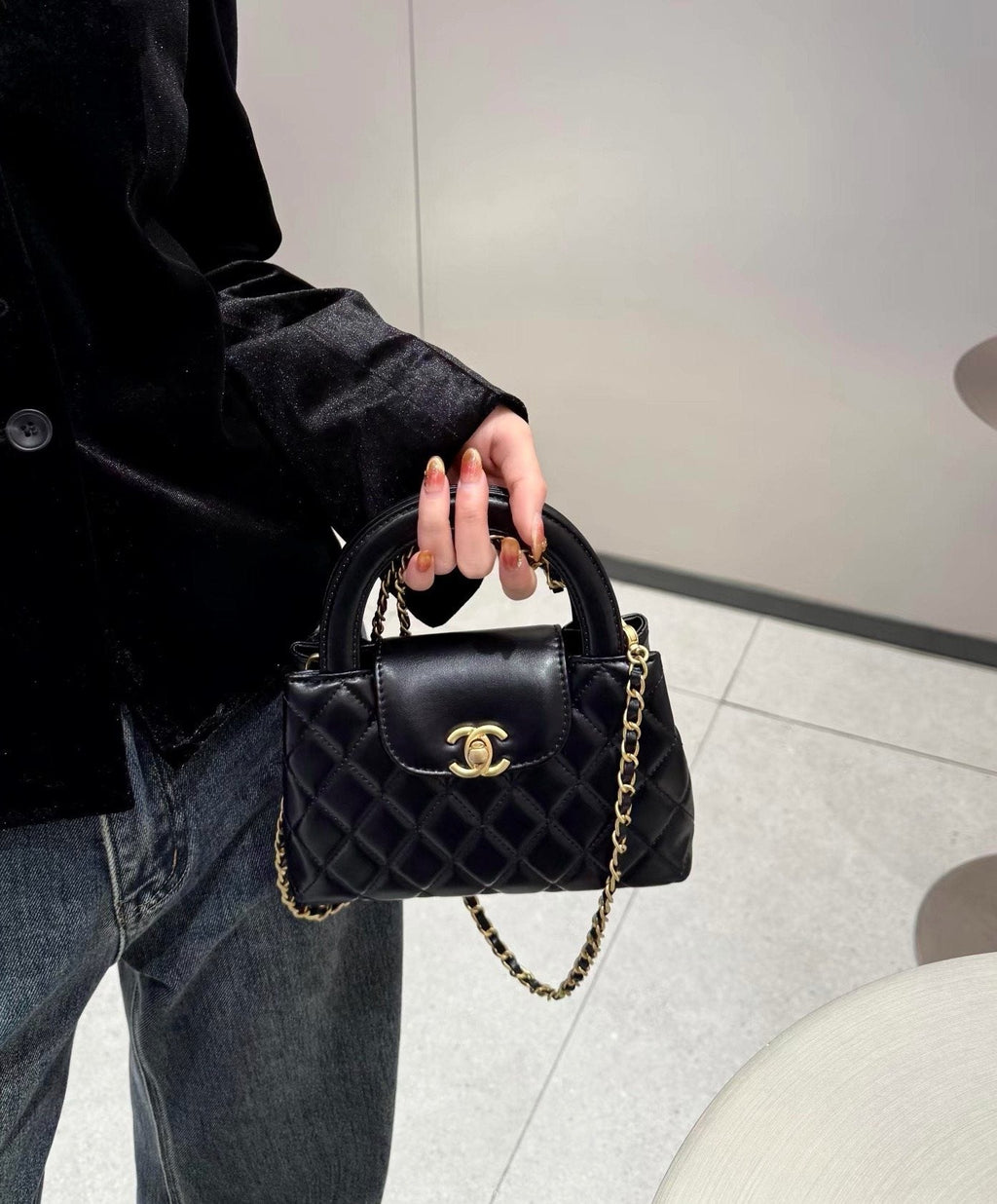 Chanel Diamond-Quilted Top-Handle Bag — model