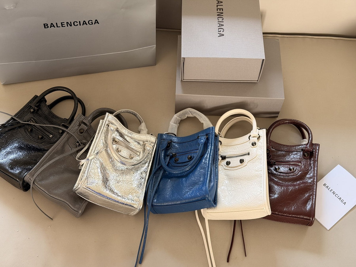 Balenciaga Le Cagole Nano Studded Phone Bag — comparison