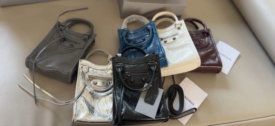 Balenciaga Le Cagole Nano Studded Phone Bag — comparison