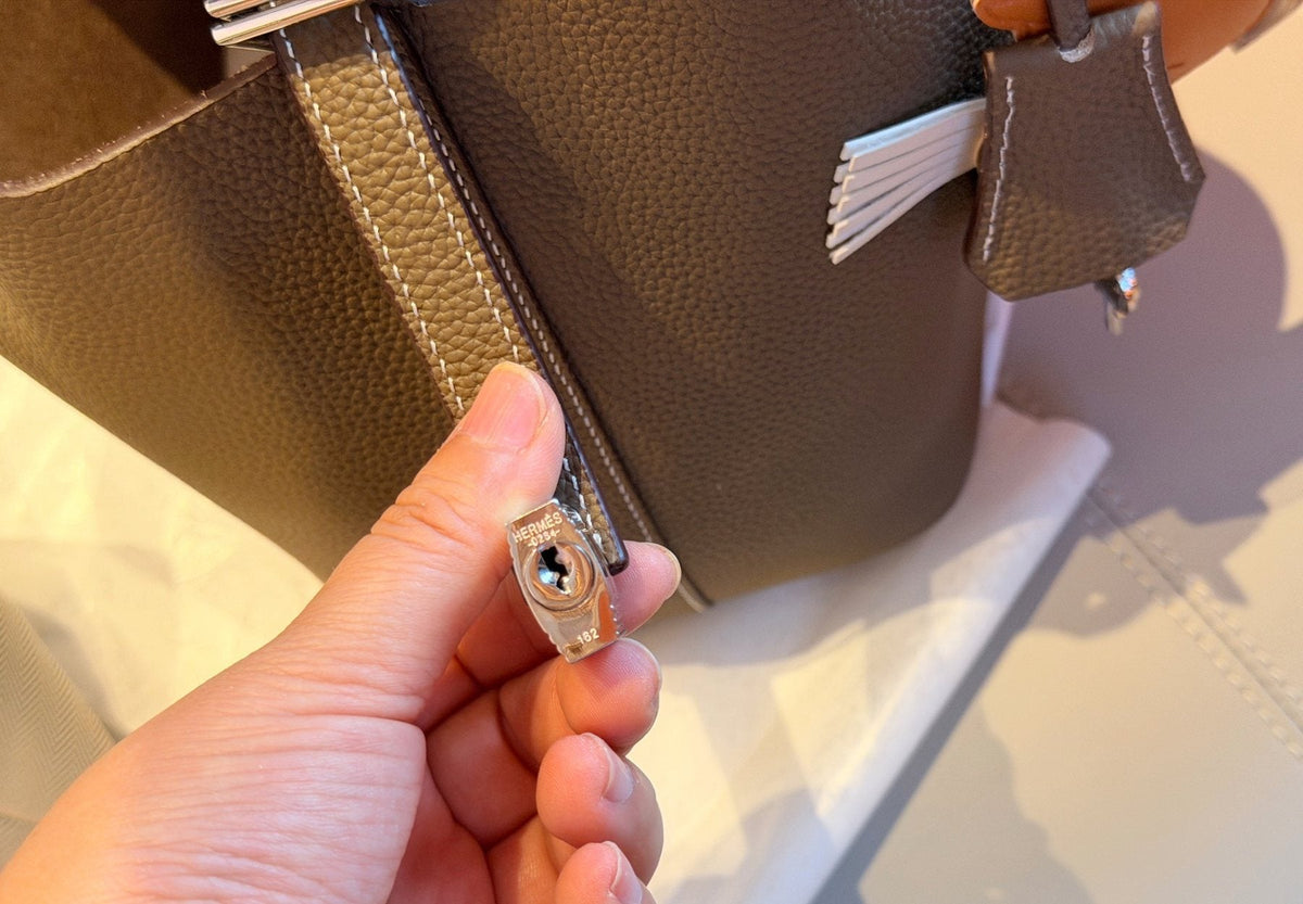 Hermès Curved-Panel Top-Handle Bucket Bag — detail