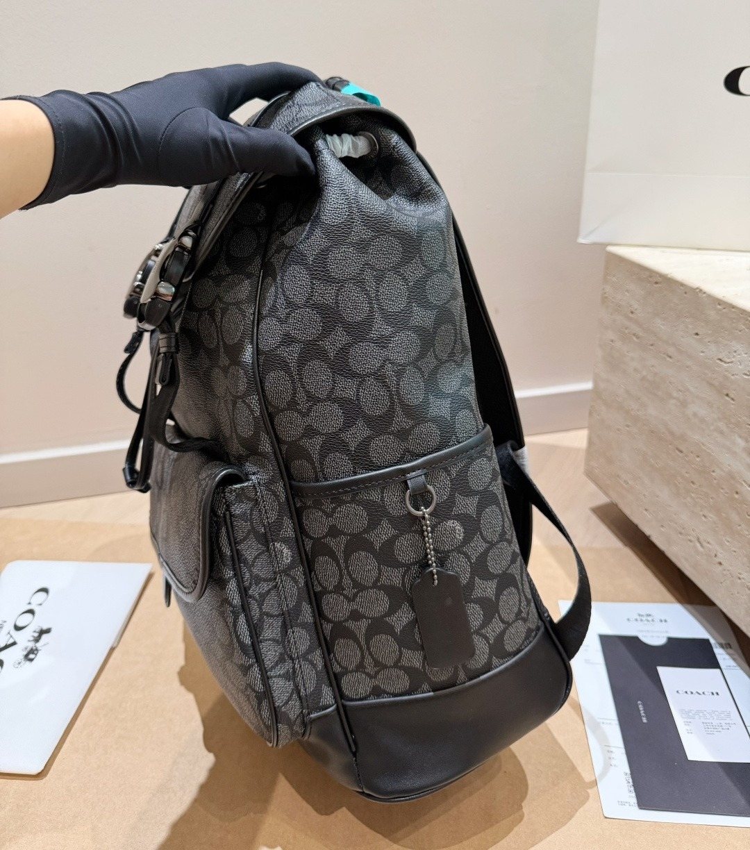 Coach Twin-Buckle Drawstring Backpack — side