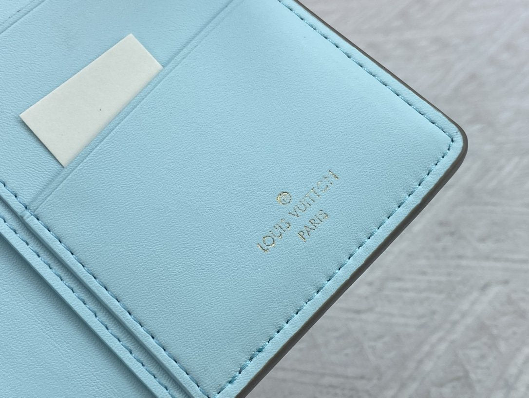 Louis Vuitton Vertical Grained Leather Wallet — detail