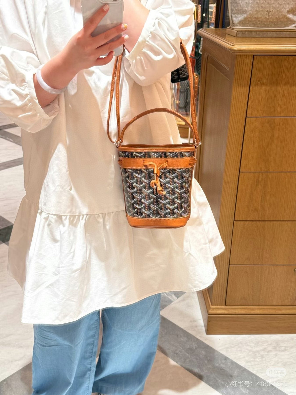 Goyard Oval Handle Drawstring Bucket Bag — model