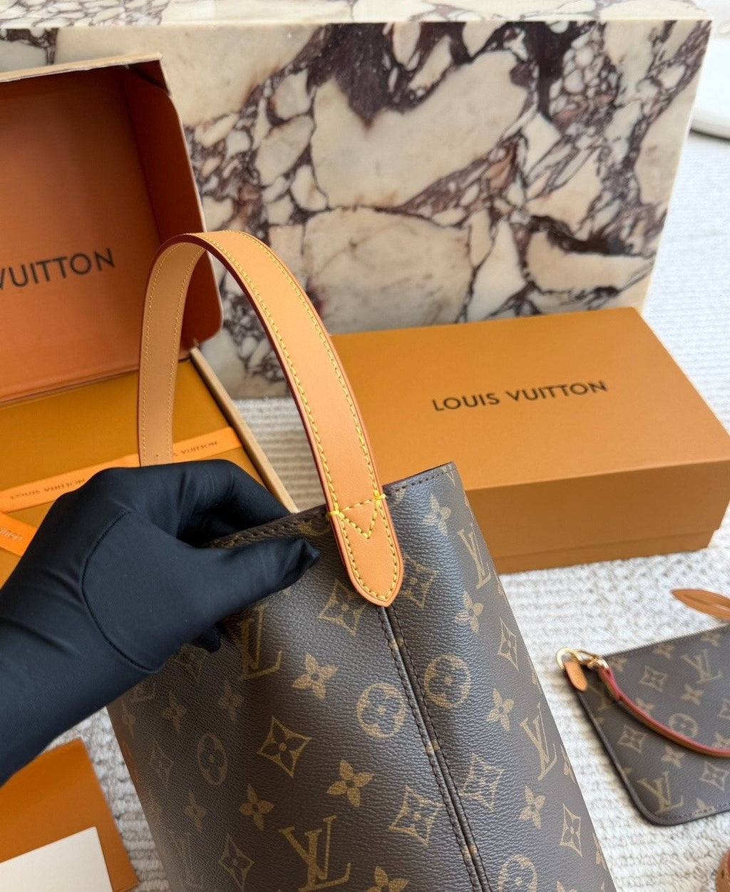 Louis Vuitton Monogram Buckle-Strap Bucket Bag — detail